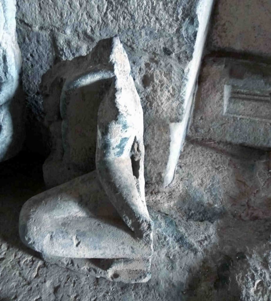 A broken statue of either Mahavira or Buddha, at Dambal, Karnataka.